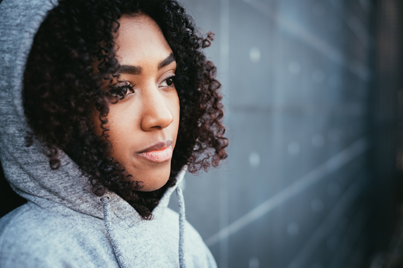 woman looking off to the side with a serious look